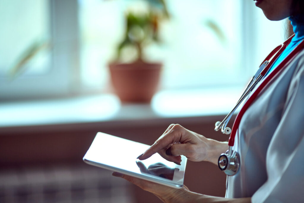 Doctor using a tablet with her hand | About us